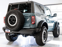 Load image into Gallery viewer, AWE Tuning 2021+ Ford Bronco 0FG Dual Rear Exit Exhaust w/Diamond Black Tips &amp; Bash Guard - 3015-33456