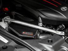 Load image into Gallery viewer, AWE Tuning 2020+ Toyota GR Supra S-FLO Carbon Intake Lid - 2660-15019