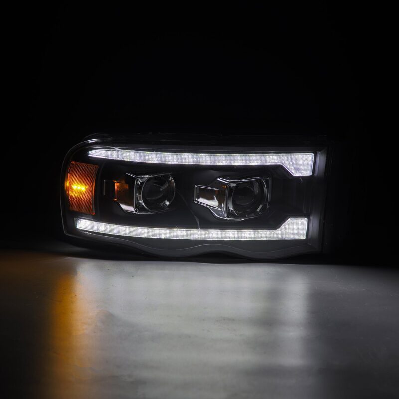 AlphaRex 02-05 Dodge Ram 1500 PRO-Series Projector Headlights Plank Style Black w/Seq Signal - 880570