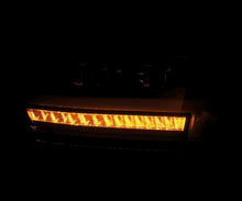 Load image into Gallery viewer, AlphaRex 19-20 Dodge Ram 1500 LUXX LED Proj Headlights Plnk Style Black w/Activ Light/Seq Signal/DRL - 880543