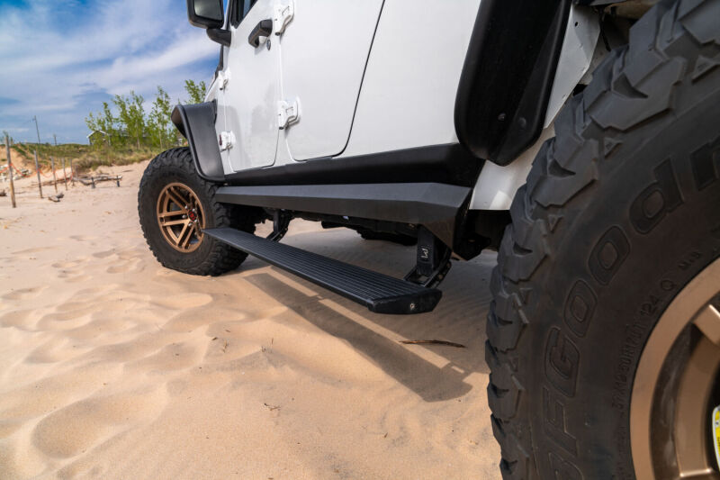 AMP Research 2007-2018 Jeep Wrangler JKU 4DR PowerStep XL - Black (Incl OEM Style Illumination) - 77122-01A