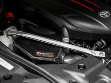 Load image into Gallery viewer, AWE Tuning 2020+ Toyota GR Supra S-FLO Carbon Intake Lid - 2660-15019
