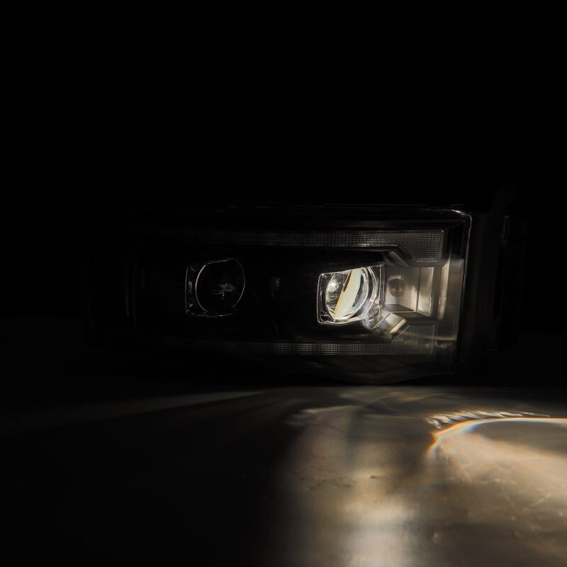 AlphaRex 02-05 Dodge Ram 1500 PRO-Series Projector Headlights Plank Style Black w/Seq Signal - 880570